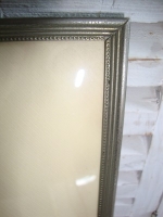 fotolijst met bol glas en parelrand zilver