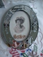 ovaal fotolijstje met spiegelrand